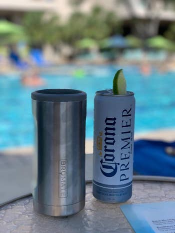 Reviewer pic of the Brumate next to a slim can of Corona