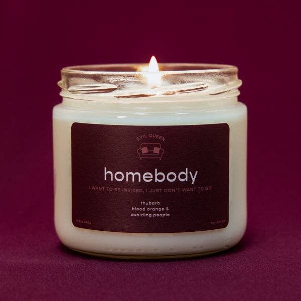 a candle with a burgundy label that says 