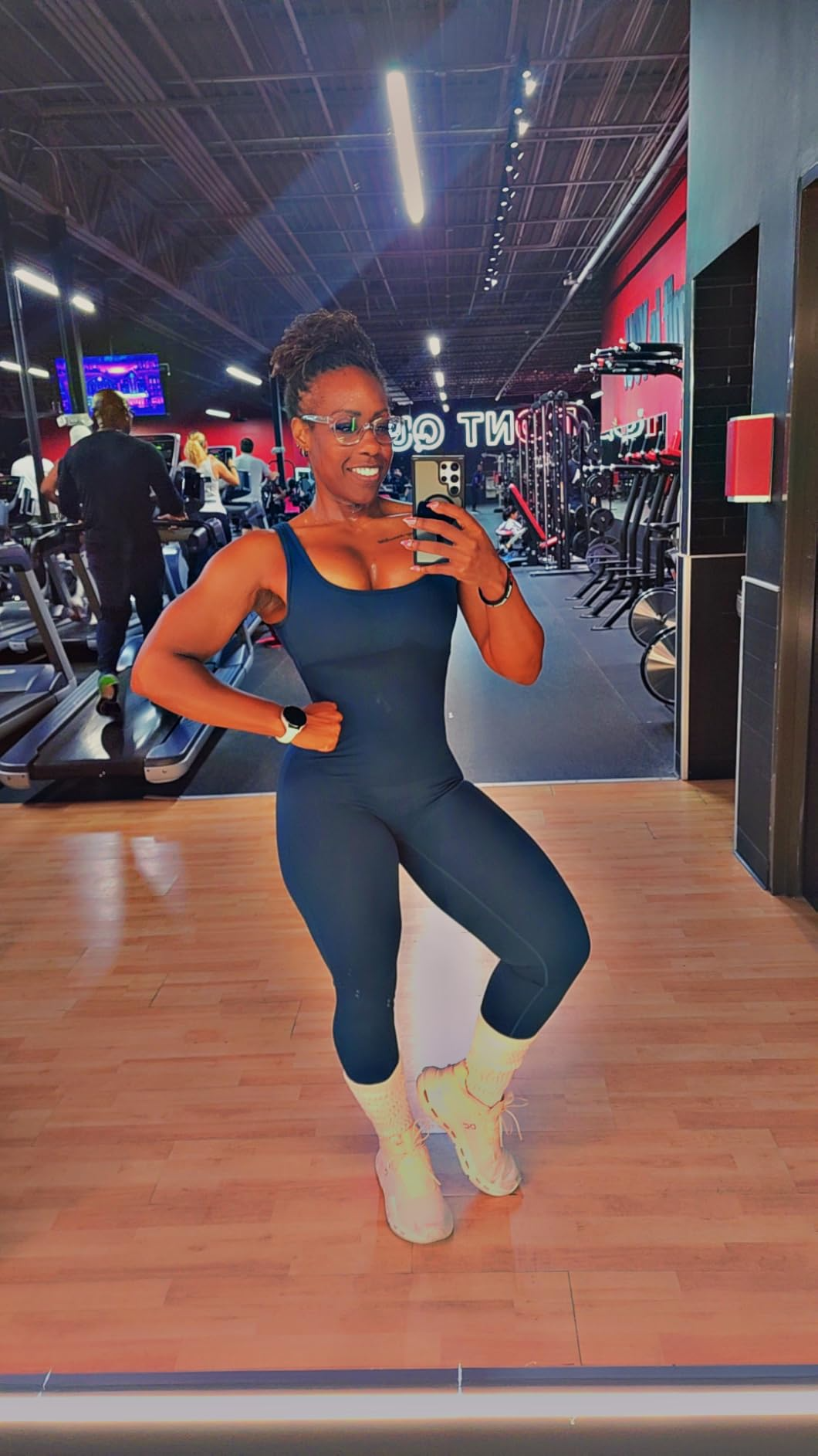 A reviewer wearing the suit at the gym