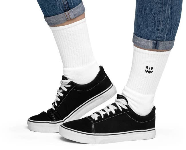 A model wearing sneakers with the socks