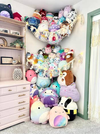 Corner of country with 2 hammocks hanging, each loaded with squishmallows