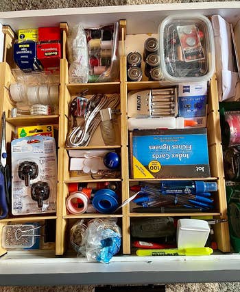 a reviewer photo of the same drawer now organized with the dividers 