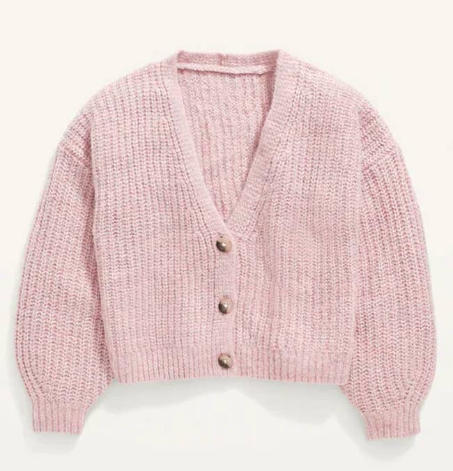 a pink button-down cardigan