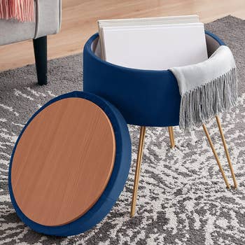 the blue ottoman with the lid off