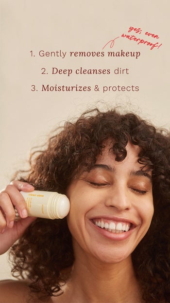 woman using cleansing stick on her face