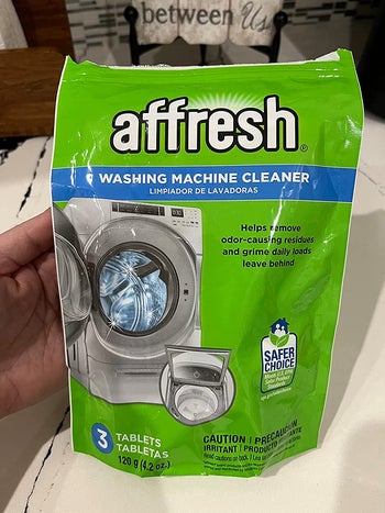 Reviewer holding the bag of tablets