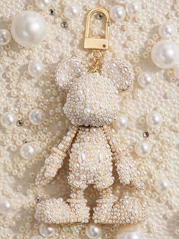 a mickey shaped keychain made of pearls