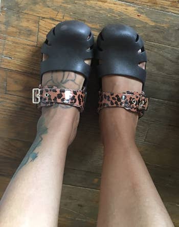 top view of the black clogs with a cheetah print strap