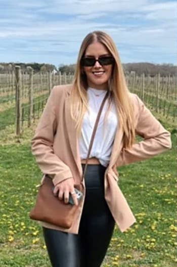another reviewer wearing the tan blazer with black pants