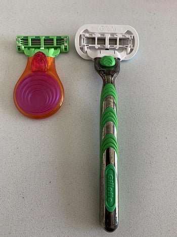 Reviewer set out compact razor next to traditional razor to show the size difference