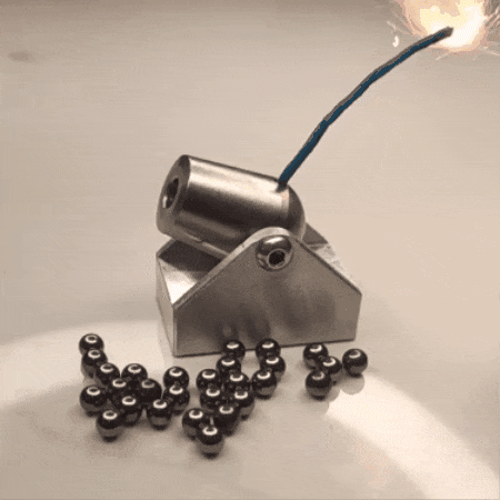 gif of a mini canon igniting and shooting a cannon ball