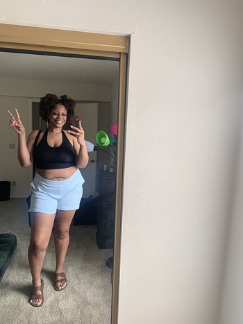 reviewer mirror selfie wearing black halter tank top