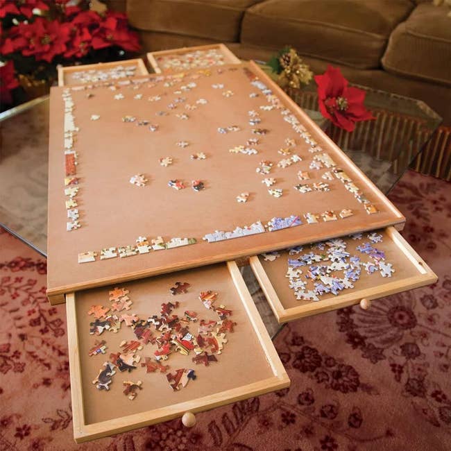 The wooden puzzle board in use on a table