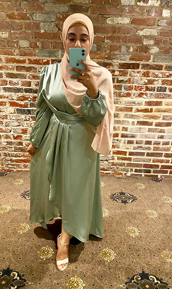 reviewer in the green dress