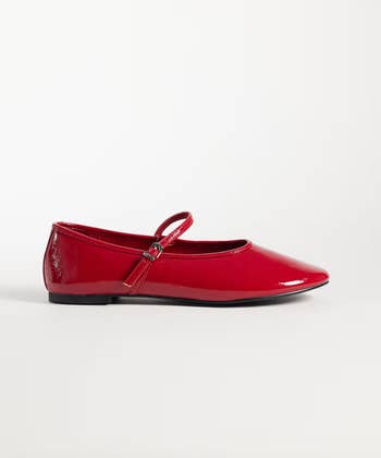 Shiny ballet level with a strap, suitable for casual wear, displayed against a plain background