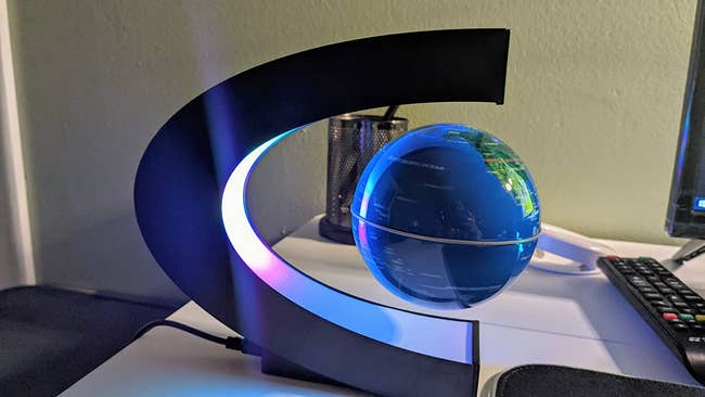 reviewer image of the magnetic levitating globe on a desk
