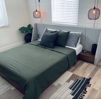 reviewer photo of nightstand bed in bedroom
