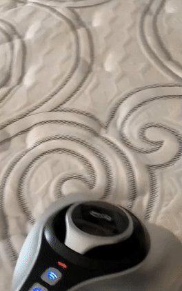 gif of reviewer using the vacuum on their mattress