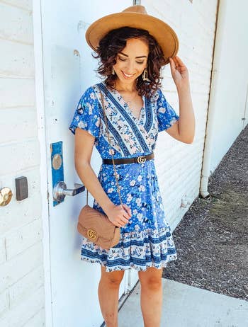 reviewer wearing the blue and white dress with a belt