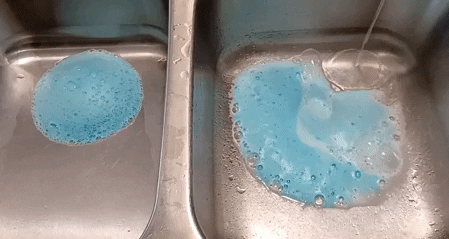 GIF of the blue disposer foaming cleanser in a sink