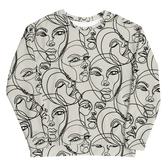 white sweatshirt with doodles of faces