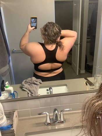 another reviewer showing off back of black top