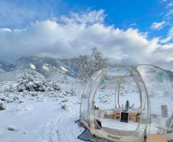 picnic set up inside tent in winter mountain scene