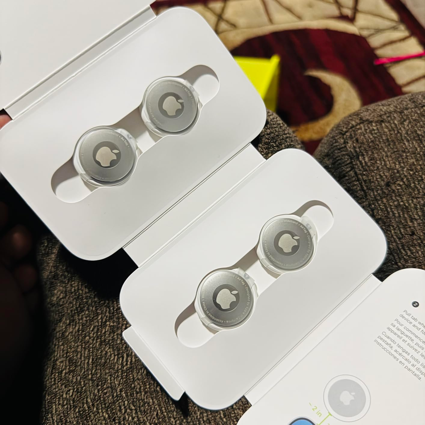 reviewer image of Apple AirTags in their packaging