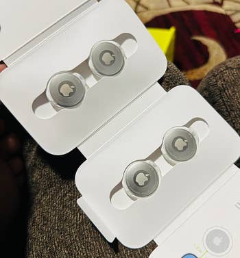 reviewer image of Apple AirTags in their packaging