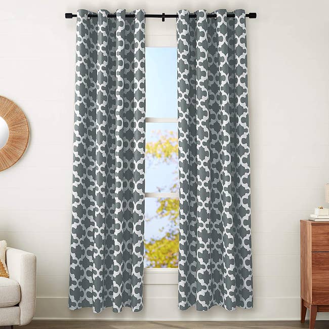 gray and white black out curtains on window