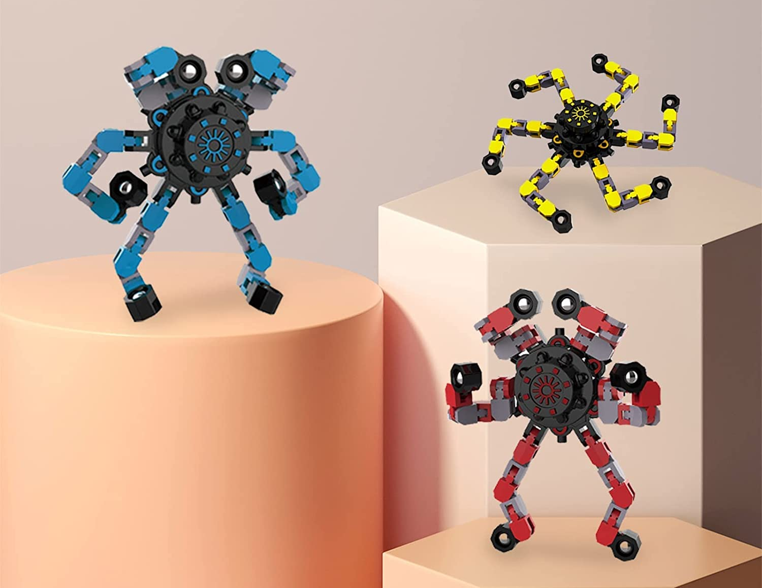 Three different fidget robot toys in blue, red, and yellow