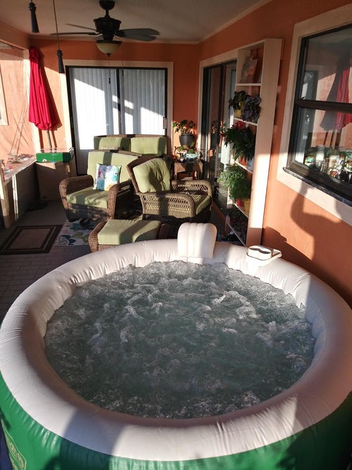 reviewer's hot tub in outdoor space