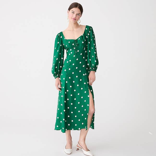 Model wearing the green polka-dot midi dress