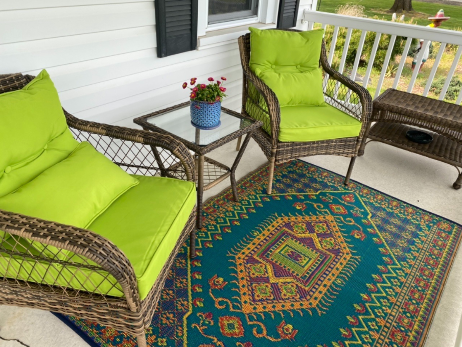 porch with colorful rug on it