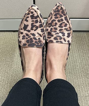 another reviewer wearing the leopard print loafers