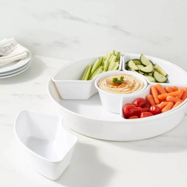 Image of white serving platter with veggies and dip