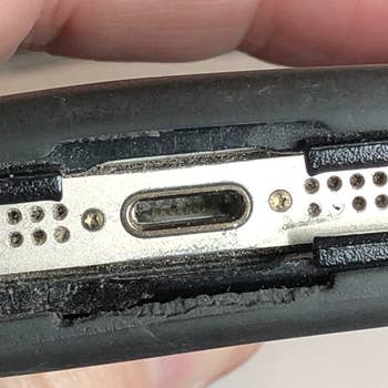 before photo of a reviewer's dirty iphone port