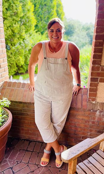 a reviewer wearing the overalls in white