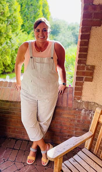 a reviewer wearing the overalls in white