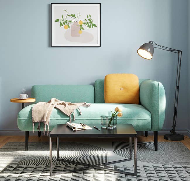 the teal-colored sofa