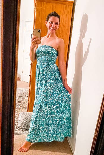 reviewer wears same style dress in a white and green floral print