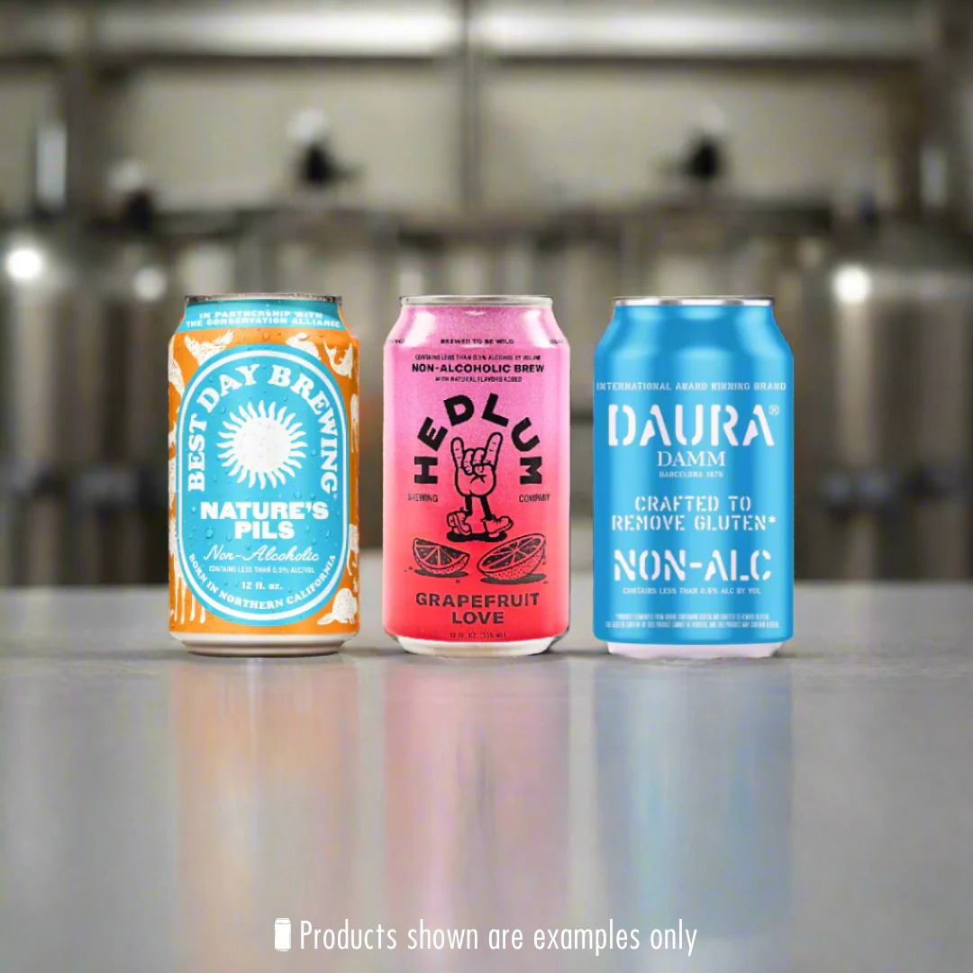 Three cans of non-alcoholic and gluten-removed beers from different brands displayed on a table