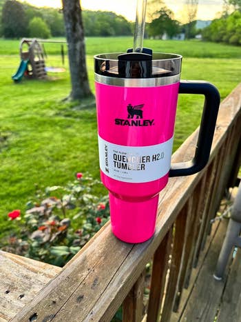 reviewer's bright pink Stanley cup