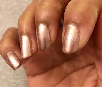 reviewer's nails perfectly painted with the shade