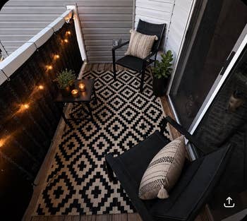 Cozy balcony with 2  chairs, patterned rug, drawstring  lights, candles, and potted plant. Inviting abstraction  for relaxation oregon  entertaining