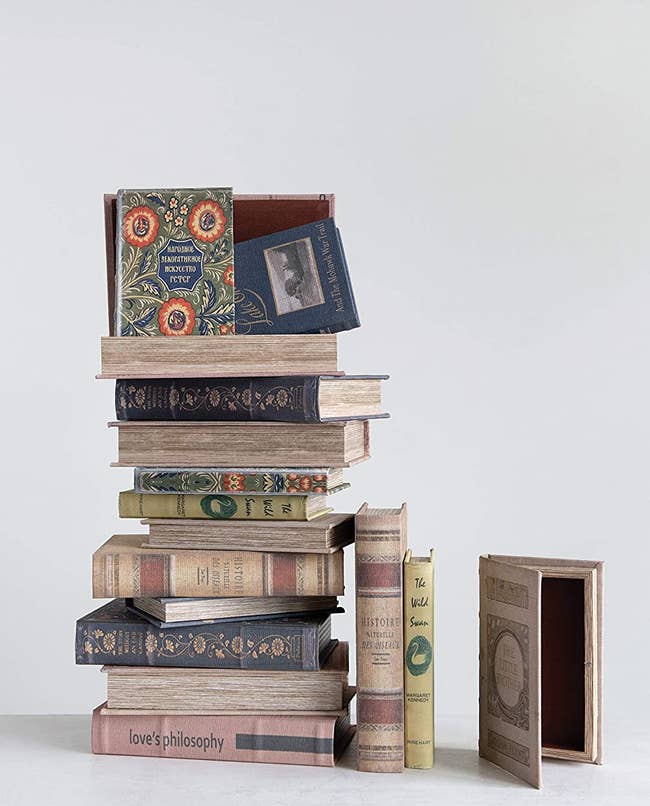 a stack of books and one showing the inside storage