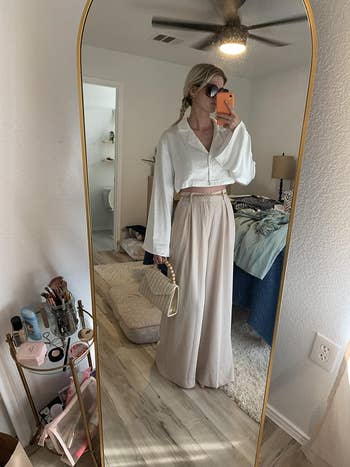 reviewer wearing the pants in beige