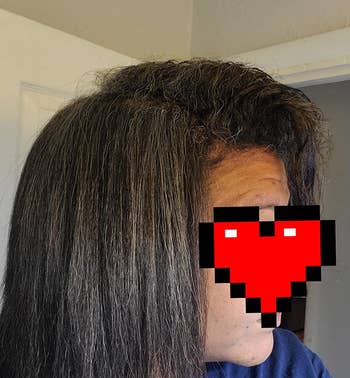 Reviewer's hair with a straightened right side and natural texture on the left