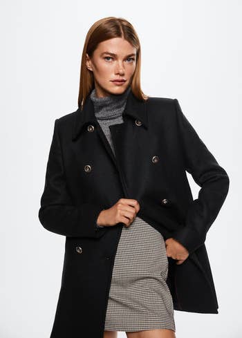 Model wearing coat unbuttoned