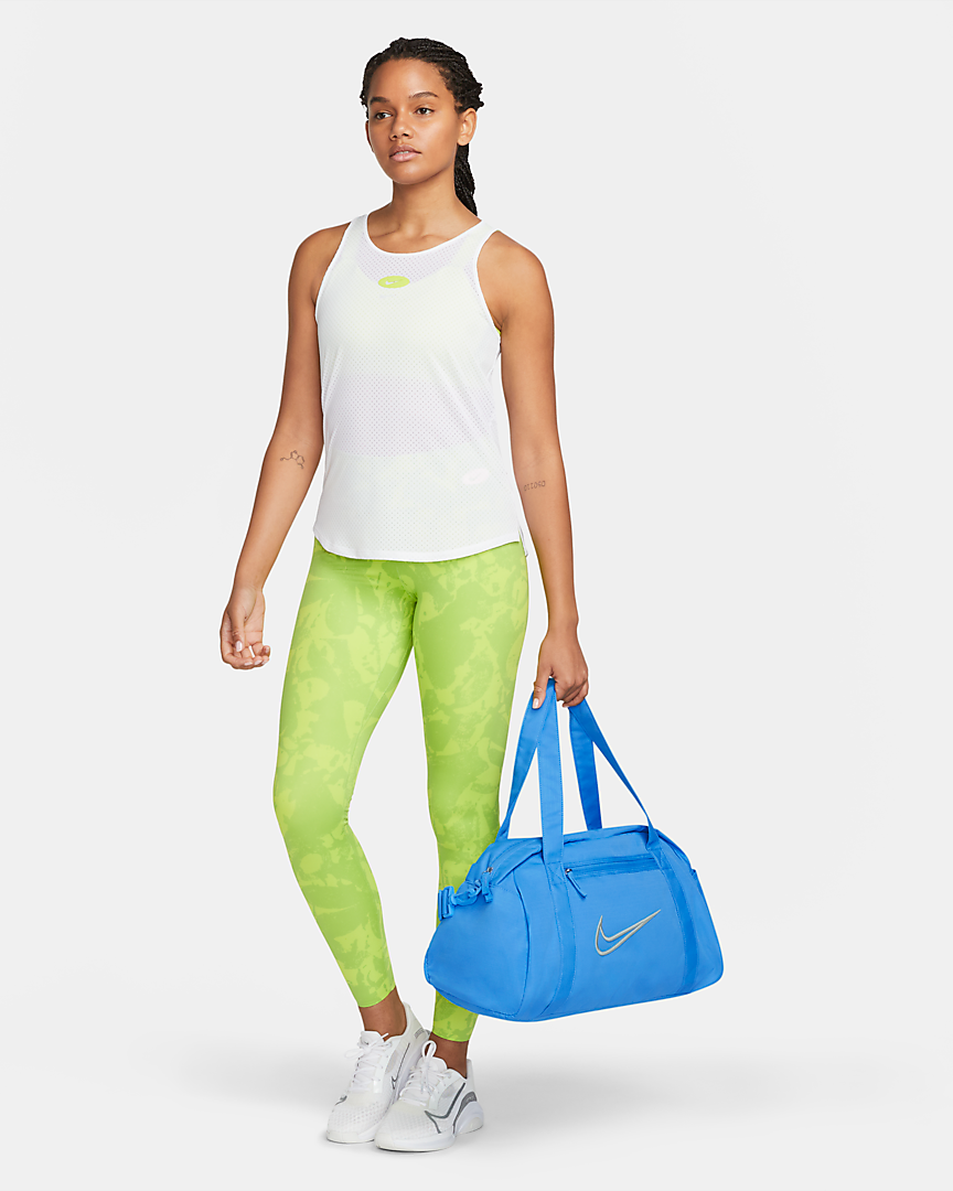 model holding electric blue Nike gym bag
